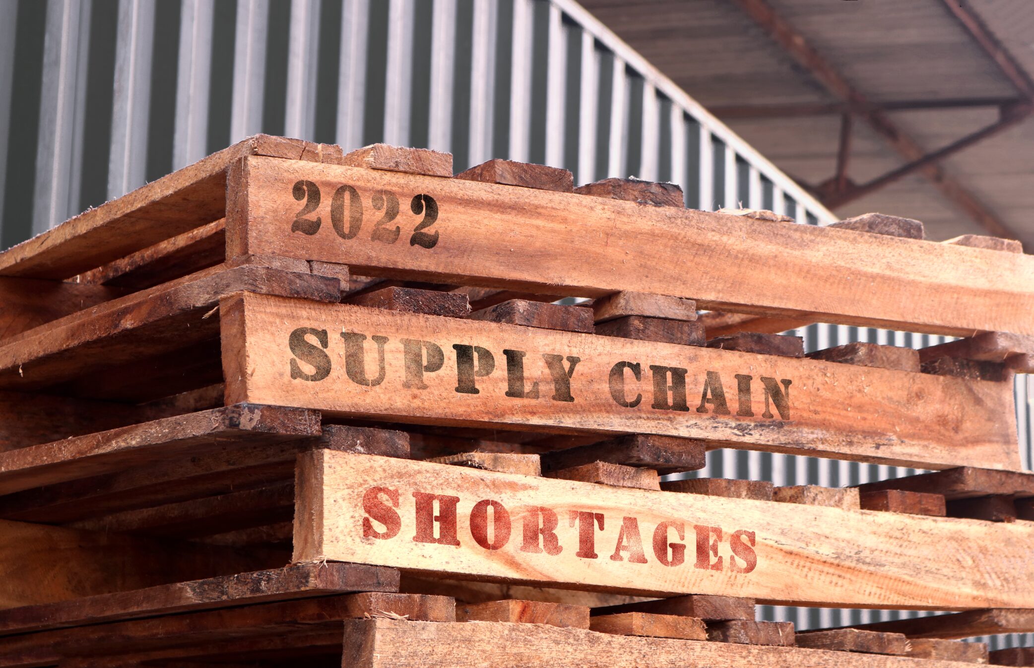 Pallets marked with the words supply chain shortages