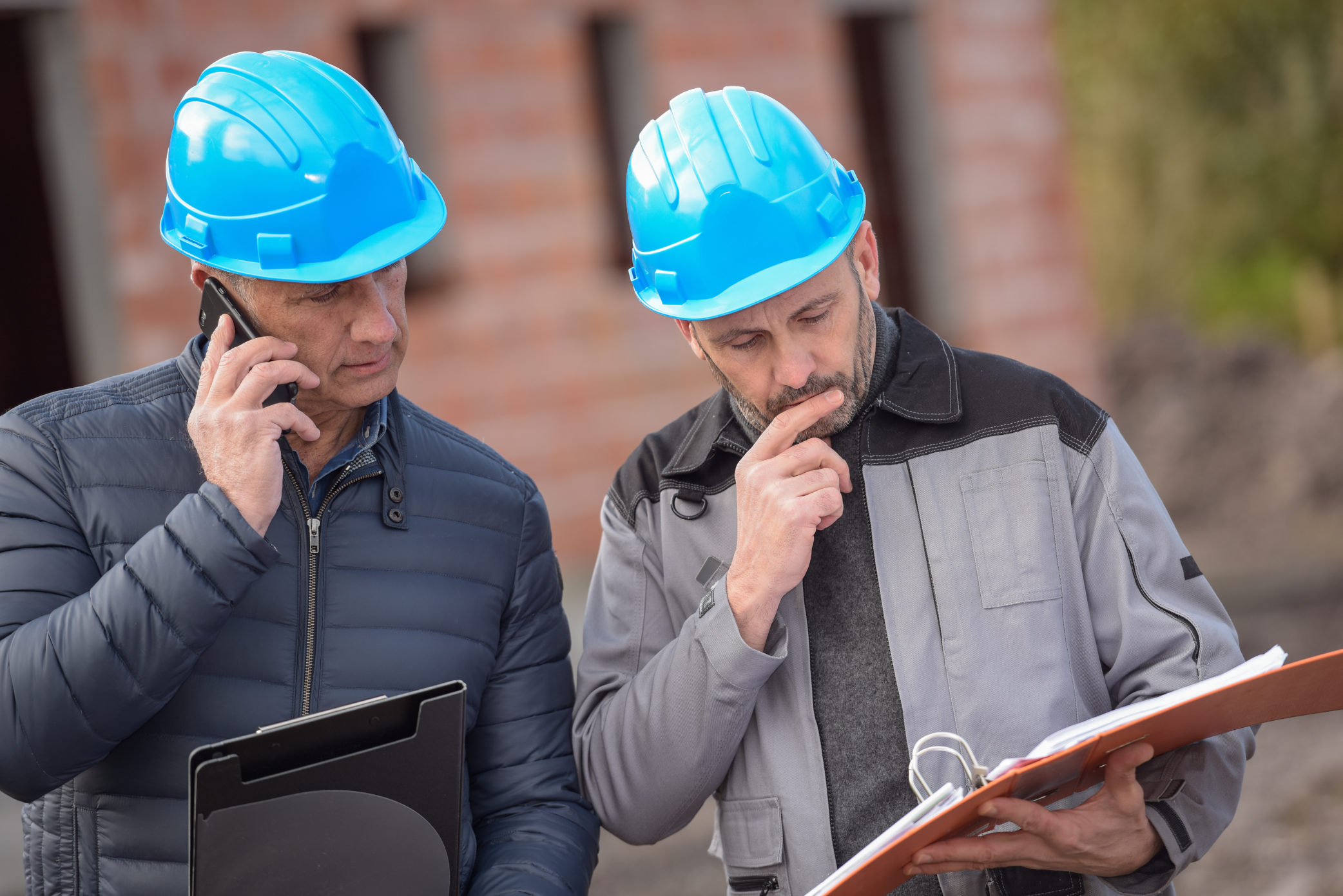 Roofing project managers working