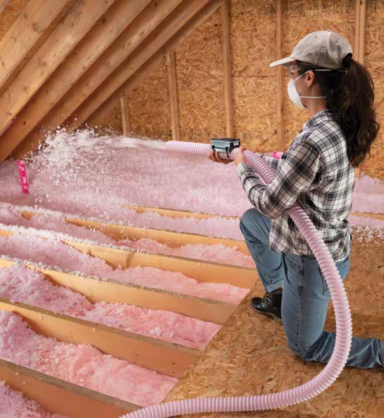 AttiCat blown-in insulation being put in an attic